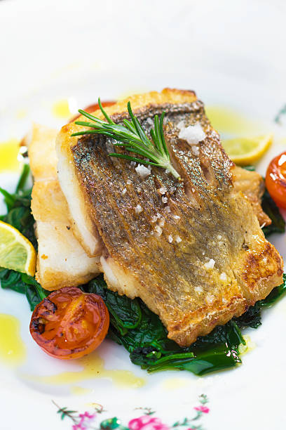 istock Sea bass fillet with spinach 501945144