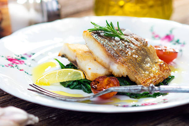 istock Sea bass fillet with spinach 501945240