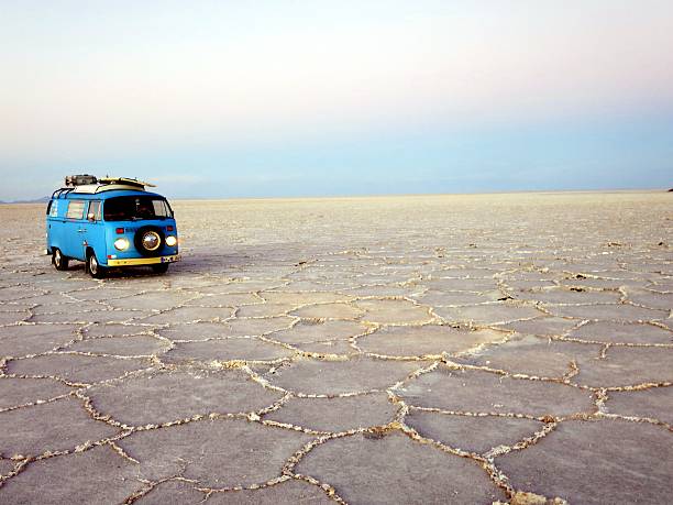 Uyuni, Bolivia - December 17, 2015: Blue VW Bus with Headlights on parked on the biggest saltflat on earth Salar de Uyuni, Bolivia