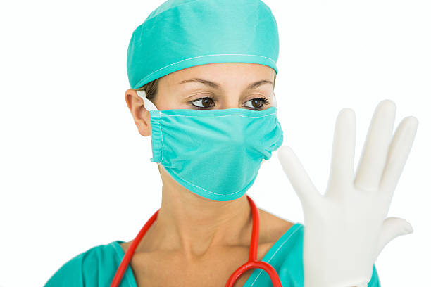 istock Medical worker putting on latex gloves. 501945727