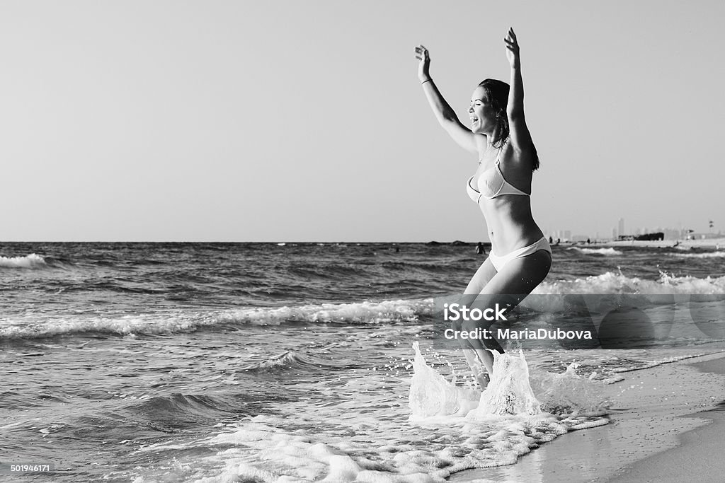 woman on the seaside woman dancing on the seaside One Person Stock Photo