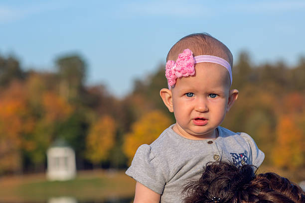 Little girl in autumn Park stock photo