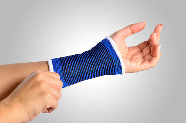 istock hand with a orthopedic wrist brace 501946883