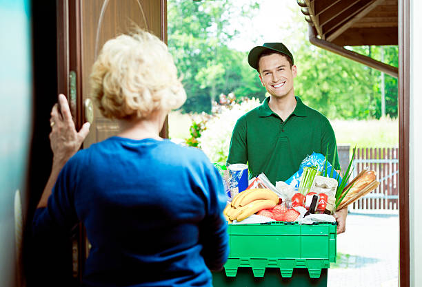 istock Delivery man with groceries 501948967