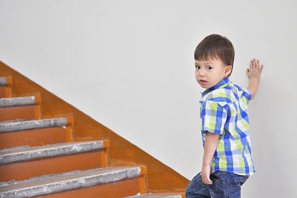 Boy  climbing up the stairs of the university, characterizes the rise due to the knowledge