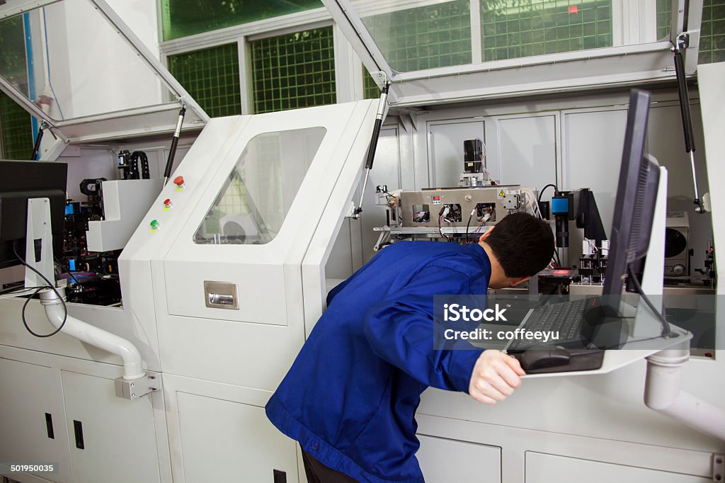Machine Under Checking Engineer Checking The Machine Stock Photo - Download Image Now ...