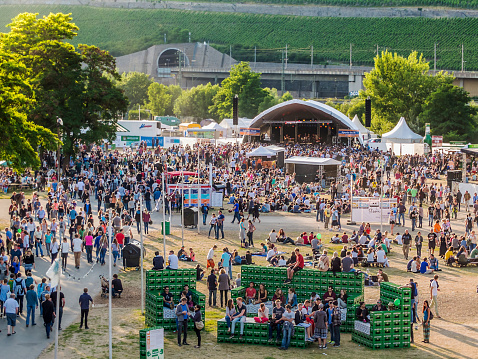Würzburg, Germany - June 22, 2014: The Umsonst und Draußen (air and free) Festival is an annual event in Würzburg. A lot of people are crowding together at this event on the Main between the two marquees.
