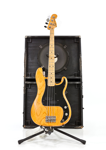 Los Angeles, California, USA - July 27, 2011:  Illustrative editorial photo of a vintage Fender Precision bass guitar with a two 15 inch speaker box.