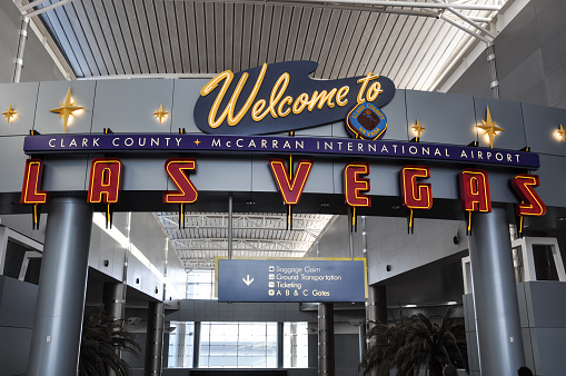 Las Vegas, USA - April 14, 2011: Welcome sign inside the Terminal of Las Vegas McCarran International Airport. Las Vegas International Airport is the principal airport serving the region.