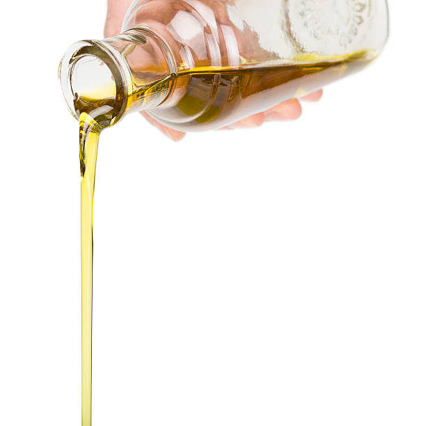 istock Oil pouring from a bottle. 501958253