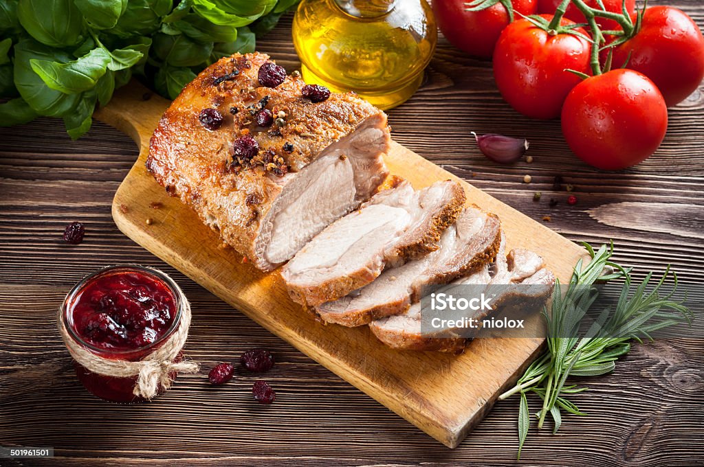 Roasted pork loin with cranberry and rosemary Baked Stock Photo