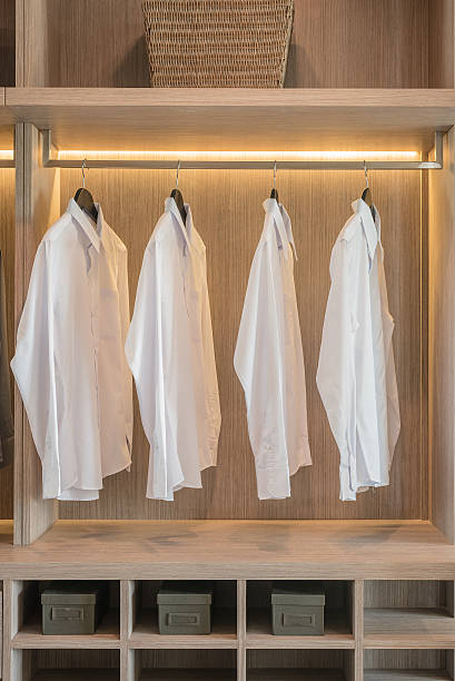 istock row of white shirts hanging on rail 501963440