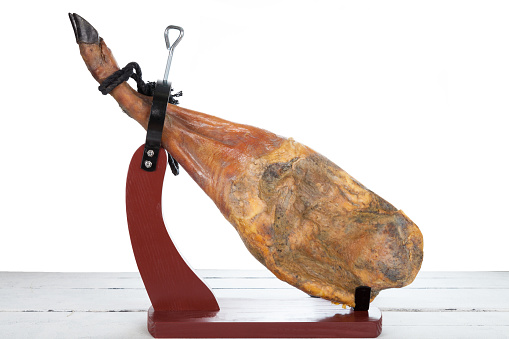 Iberian  ham with exposed on a white background