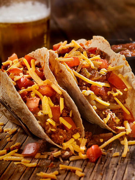 istock Tacos With Salsa, Cheese and a Beer 501964060