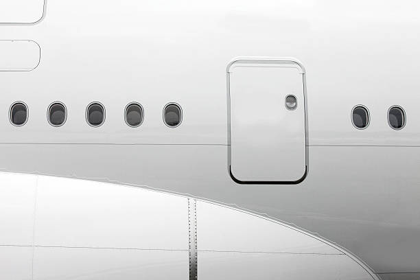 istock Jet airplane windows and cabin door from outside, white fuselage 501964101