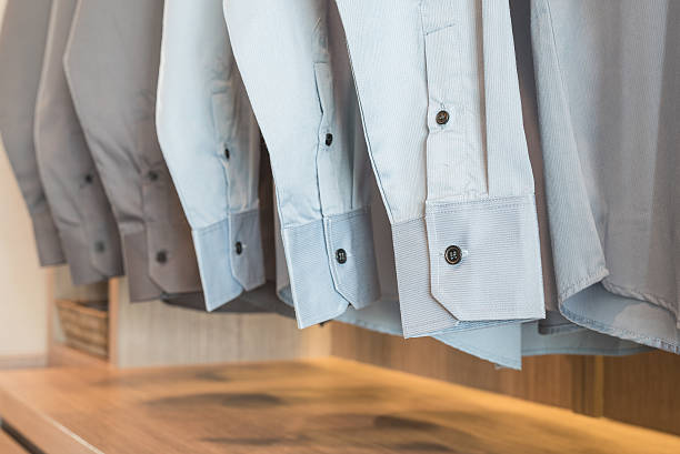 istock row of shirts hanging on rack with buttons 501964592