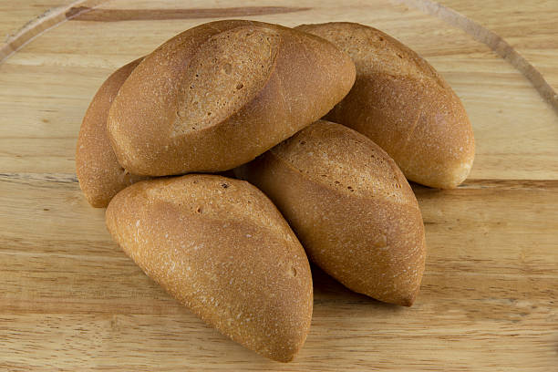 istock Bread Rolls on Wooden Tray 501964824