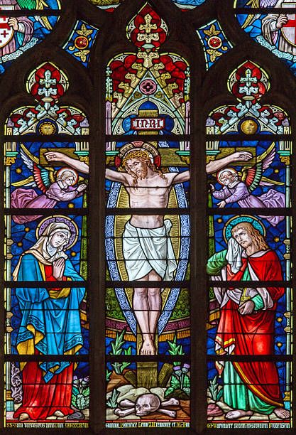Bruges - Crucifixion on windowpane in Salvator's Cathedral Bruges - The Crucifixion on the windowpane in St. Salvator's Cathedral (Salvatorskerk)  by stained glass artist Samuel Coucke (1833 - 1899). st salvator's cathedral stock pictures, royalty-free photos & images