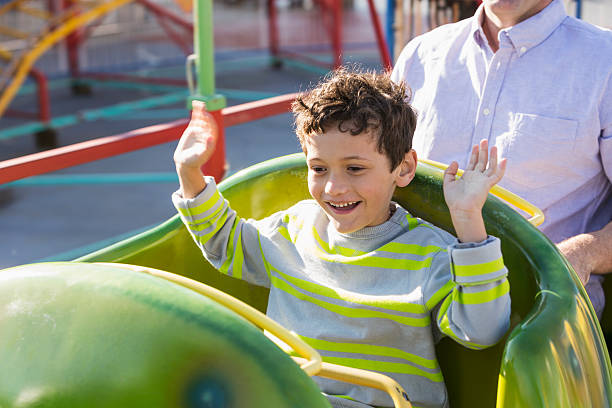 istock Little boy at amusement park 501965771