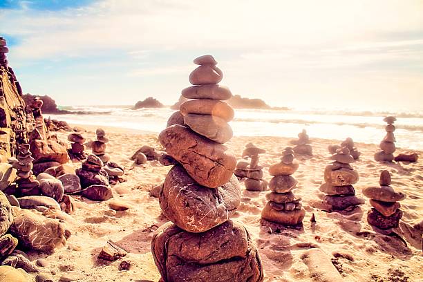 istock stone balancing at the beach with summer sunlight 501967034