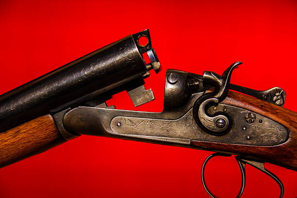 istock Hunting gun and red backgroung 501968500