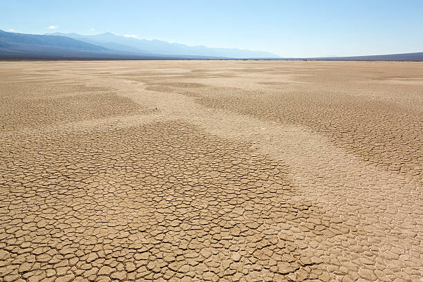 Dry, arid desert landscape with drought cause crack formations, from Death Valley, Racetrack Playa.