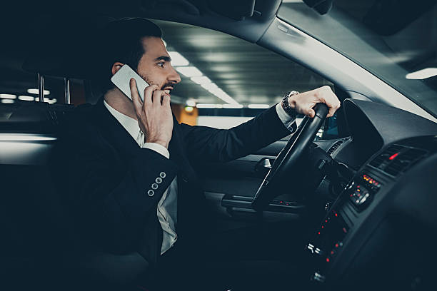 istock Businessman driving car 501970674