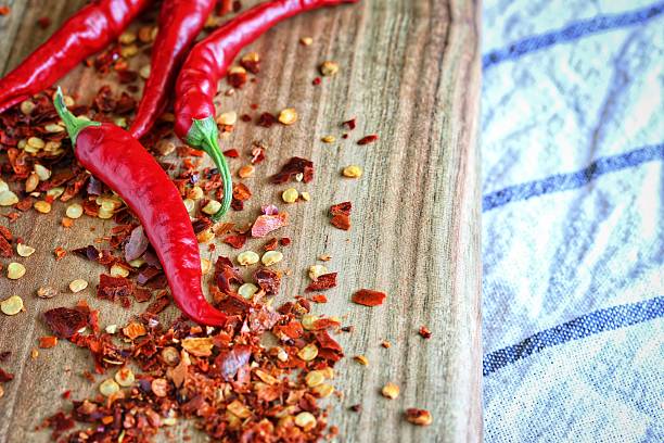 istock Fresh Red Chilli On Wooden Cutting Board 501972948