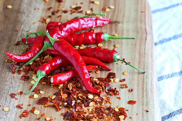 istock Fresh Red Chilli On Wooden Cutting Board 501973012