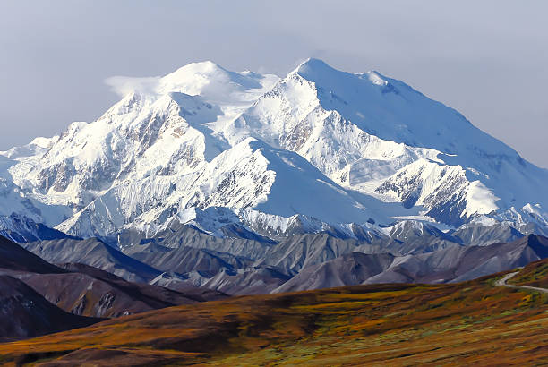 Denali Majestic Denali with small cloud at the top denali mountain stock pictures, royalty-free photos & images