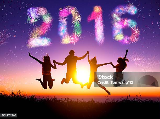 Young Group Watching Fireworks And Happy New Year 2016 Concept Stock Photo - Download Image Now