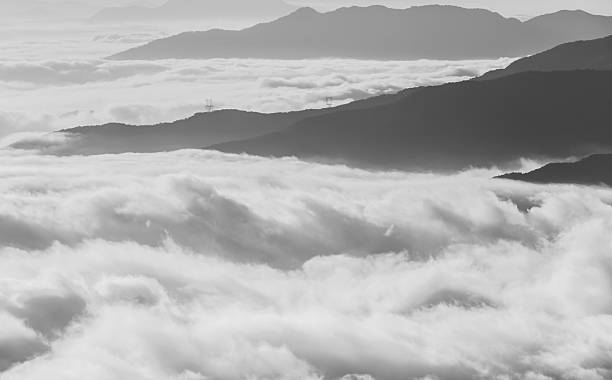 istock fog and cloud mountain valley landscape in black and white. 501974838