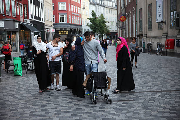 Moroccan family walking in Copenhagen, Denmark. stock photo