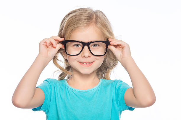 istock Little girl trying on glasses 501977350