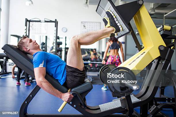 Young People In Gym Leg Press Workout Stock Photo - Download Image Now - Leg Press, Exercising, Relaxation Exercise