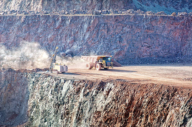 istock dumper truck on road in surface mine quarry 501997453