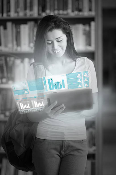 istock Cheerful pretty student working on her futuristic tablet 501998833