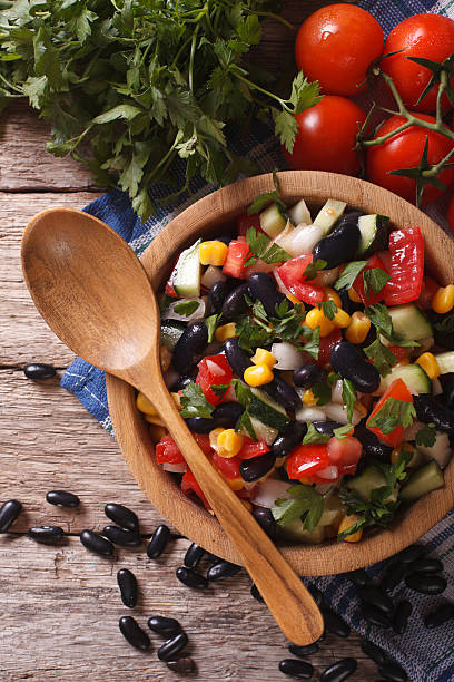 istock vegetable salad with black beans close-up vertical top view 502001234