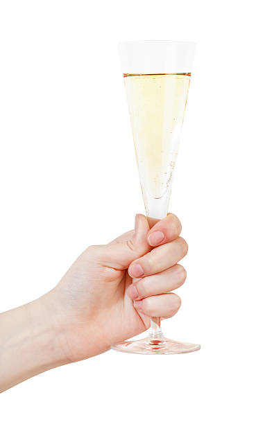 istock hand raises glass with champagne 502001413