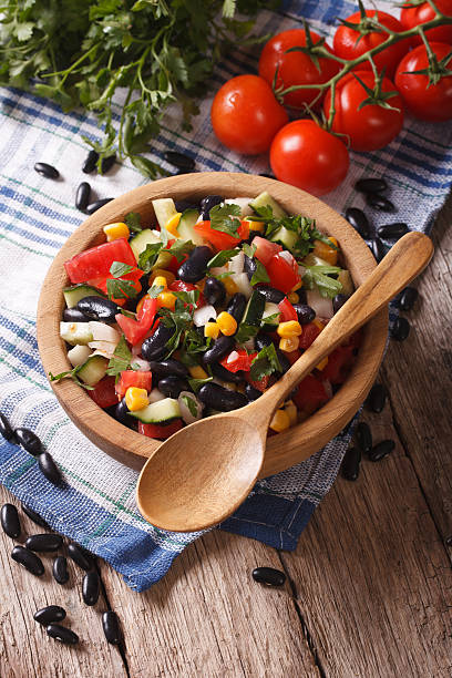 istock vegetable salad with black beans and ingredients on the table 502001730