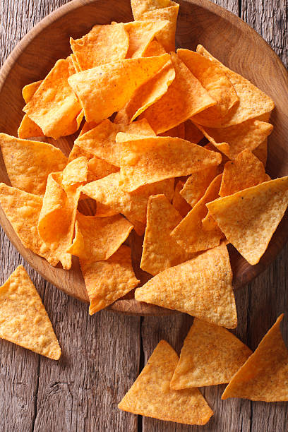 istock Nachos corn chips in the bowl close-up. vertical top view 502003036