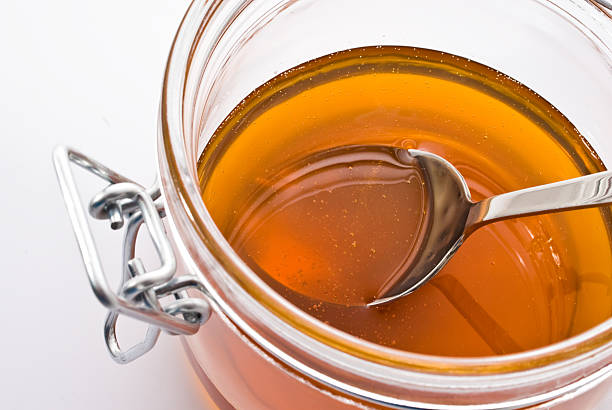 istock jar of honey on white background 502003119