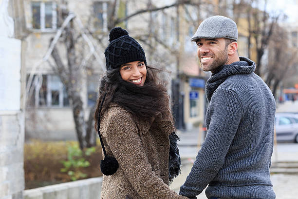 istock Beautiful young couple holding hands 502004222