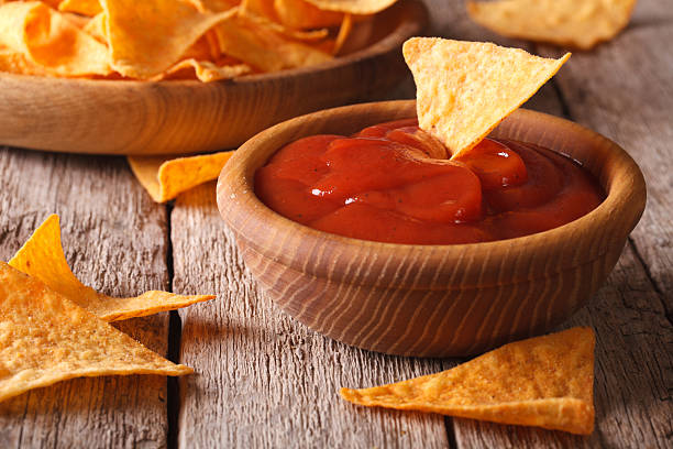 istock Nachos corn chips with spicy sauce closeup. horizontal 502004418