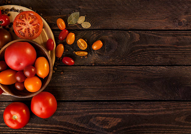 istock tomatoes on dark wooden background 502005780