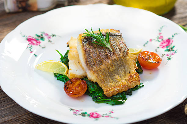istock Sea bass fillet with spinach 502014256