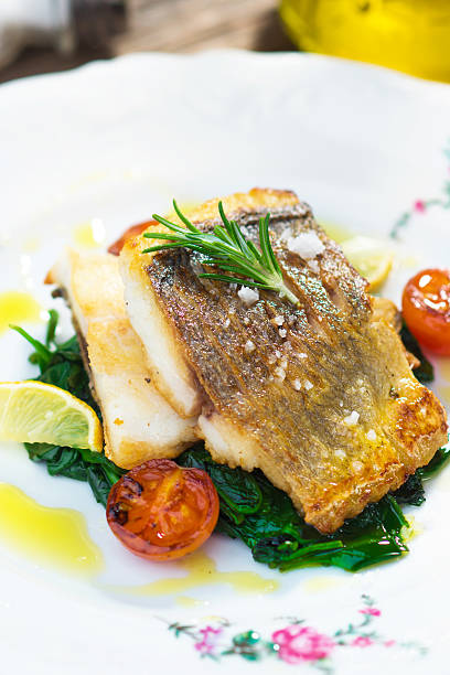 istock Sea bass fillet with spinach 502014332
