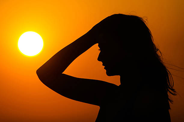 istock Woman silhouette on sunset 502019273