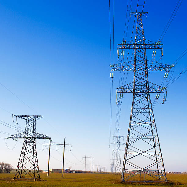 istock Electricity pylon against blue cloudy sky 502021309