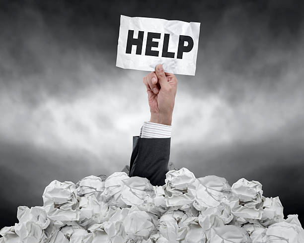 istock Businessman  under crumpled paper 502021475